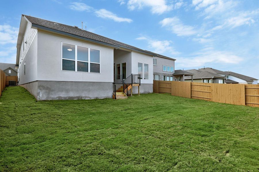 Exterior details and patio area of a home in The Colony, Bastrop (Image 26).