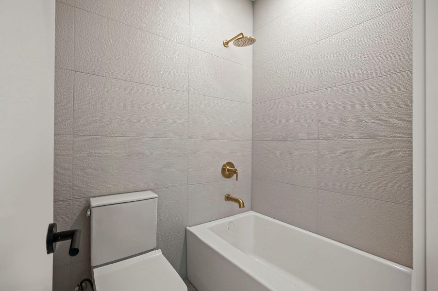 Bathroom with shower / tub combination and toilet Bathroom with shower / tub combination and toilet