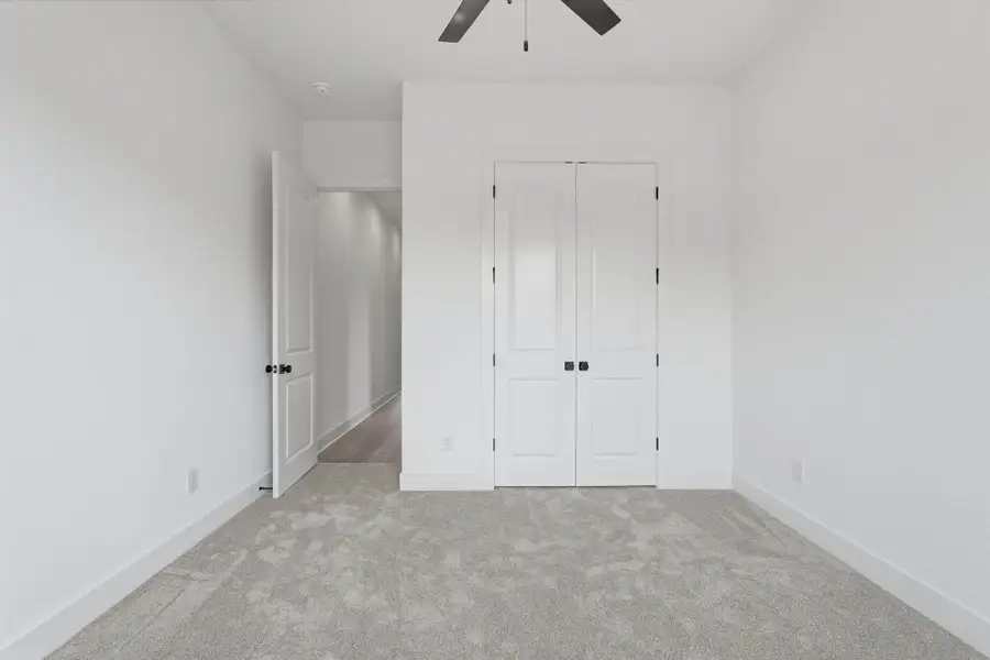 Multiple secondary bedrooms provide versatility for family, guests, or work-from-home needs.