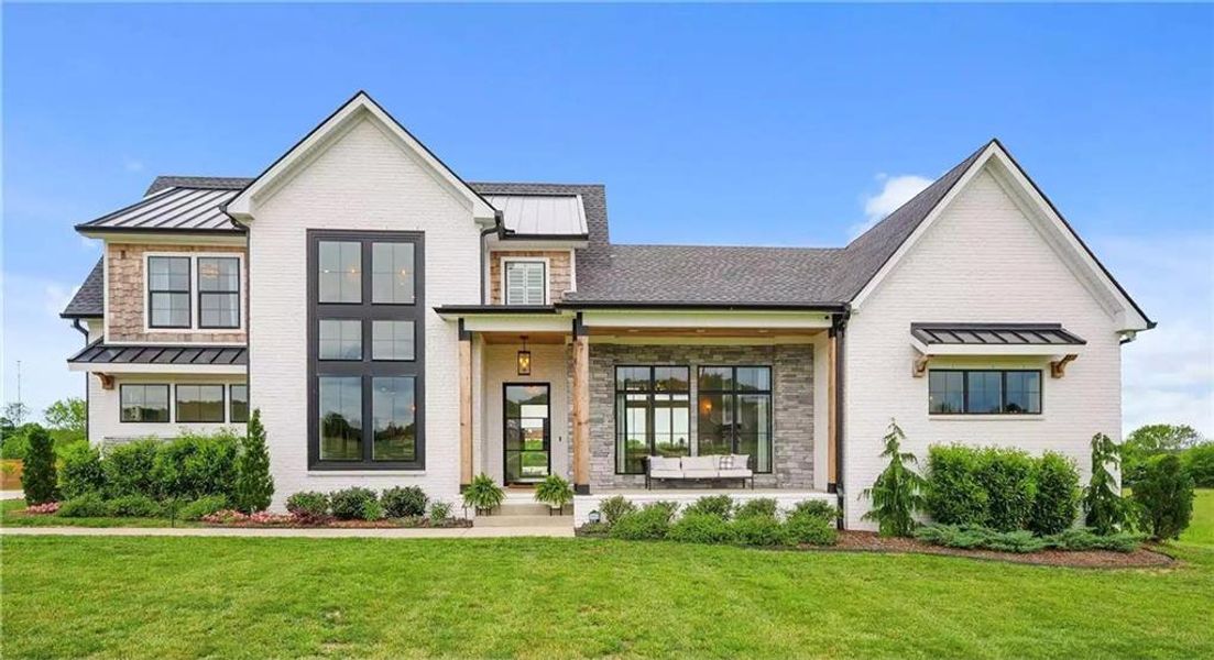 Front exterior of a new home in , Fayetteville, GA, highlighting curb appeal (Image 1). Front exterior of a new home in , Fayetteville, GA, highlighting curb appeal (Image 1).
