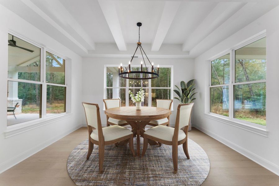 Beautiful dining room overlooking the back of the property.
