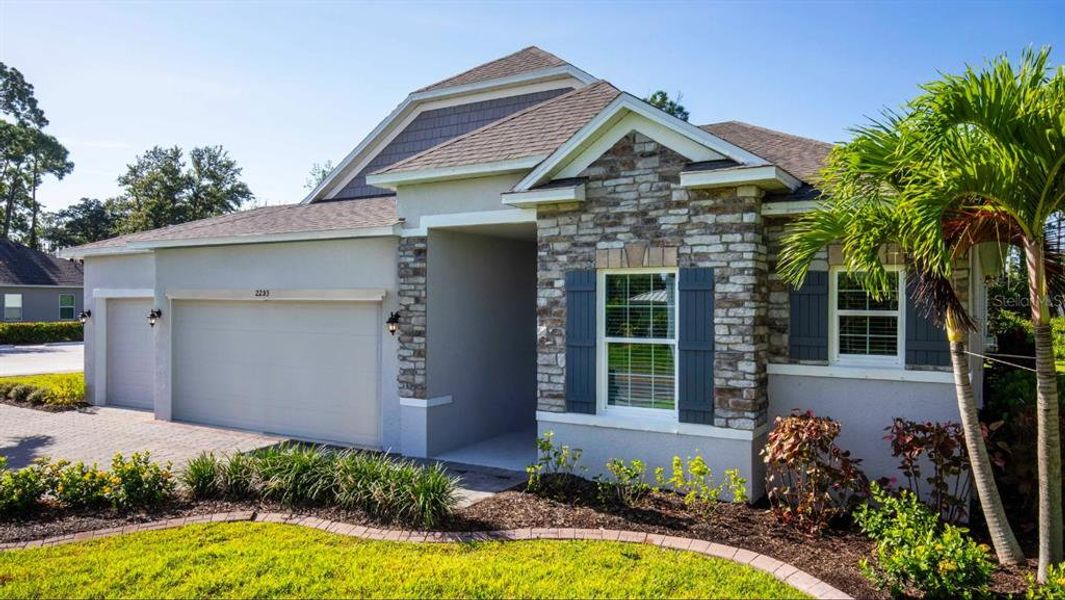 Front exterior of a new home in Sugarmill Woods, Homosassa, FL, highlighting curb appeal (Image 2). Front exterior of a new home in Sugarmill Woods, Homosassa, FL, highlighting curb appeal (Image 2).