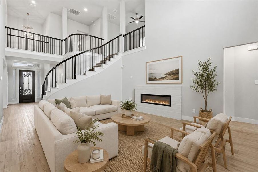 Open living room with abundant natural light and a seamless flow into the main living areas. Virtually staged.