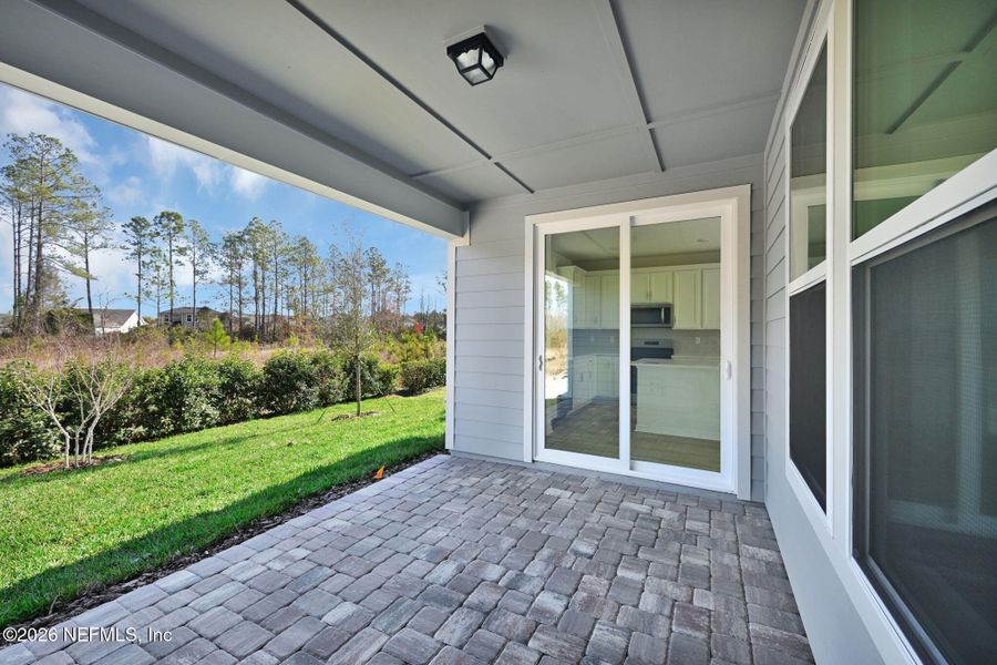 Exterior details and patio area of a home in Del Webb Wildlight, Yulee (Image 3).