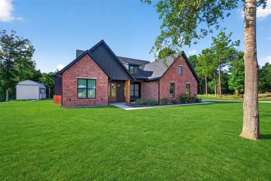 Front exterior of a new home in , Kilgore, TX, highlighting curb appeal (Image 25).