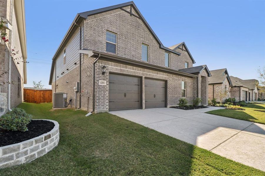 Exterior details and patio area of a home in Lakehaven - Premier Series, Farmersville (Image 21). Exterior details and patio area of a home in Lakehaven - Premier Series, Farmersville (Image 21).