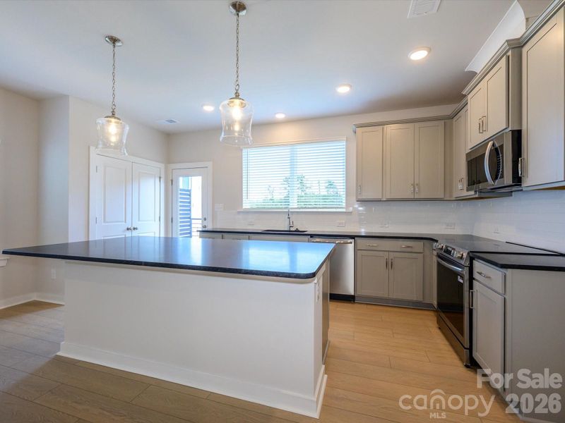 Furnished interior view inside a new home in Central Living at Craig, Charlotte (Image 5).
