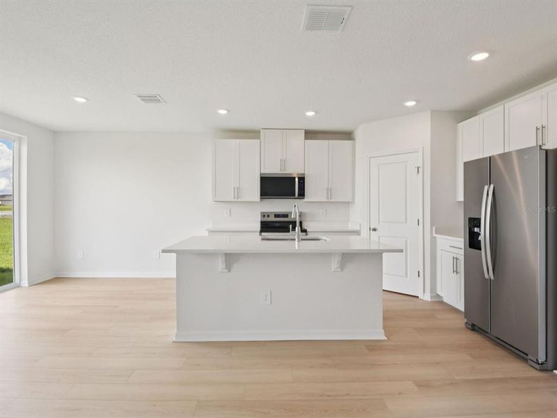 Furnished interior view inside a new home in The Grove at Stuart Crossing - Classic Series, Bartow (Image 3).