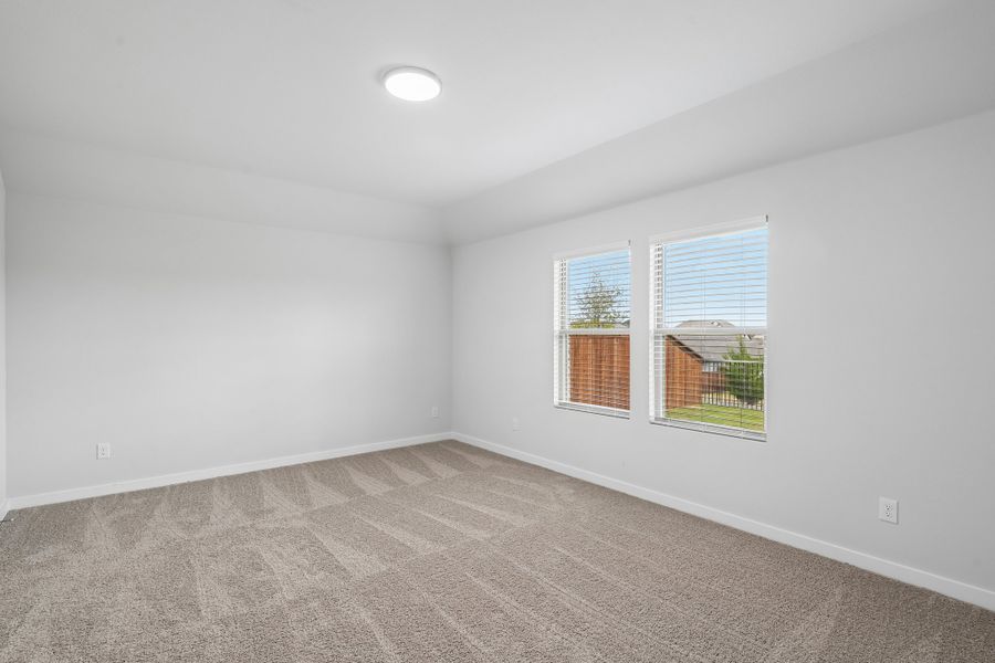 Primary Bedroom in the Hayden home plan by Trophy Signature Homes