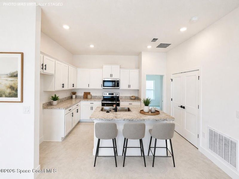 Furnished interior view inside a new home in St. John's Preserve, Palm Bay (Image 6).