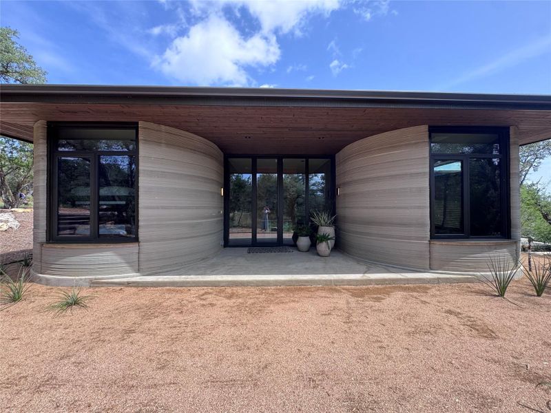 An innovative facade with textured walls and sleek windows defines this modern home's unique curb appeal. An innovative facade with textured walls and sleek windows defines this modern home's unique curb appeal.
