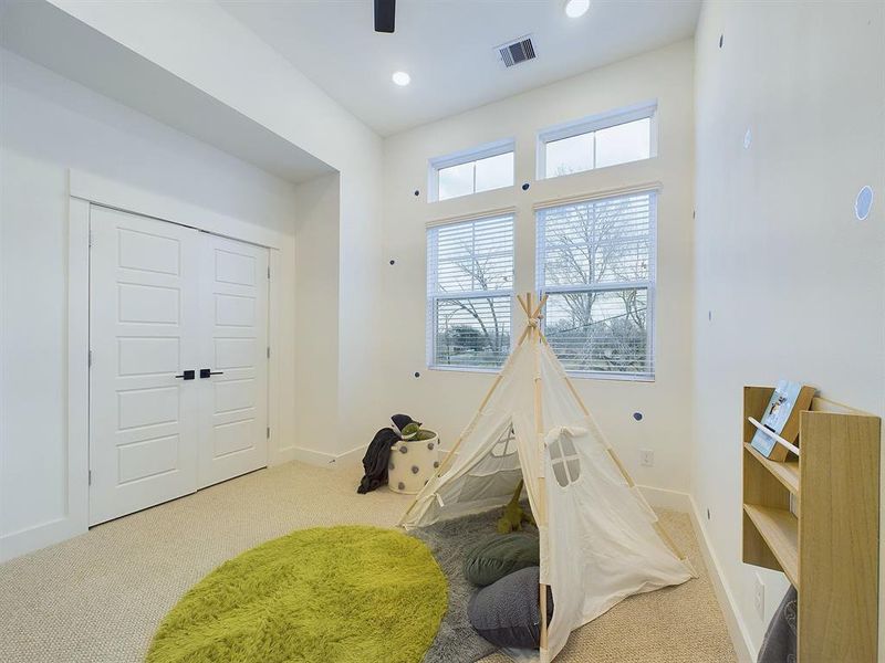 Secondary Bedroom offering high ceilings and top windows for amazing natural lighting.