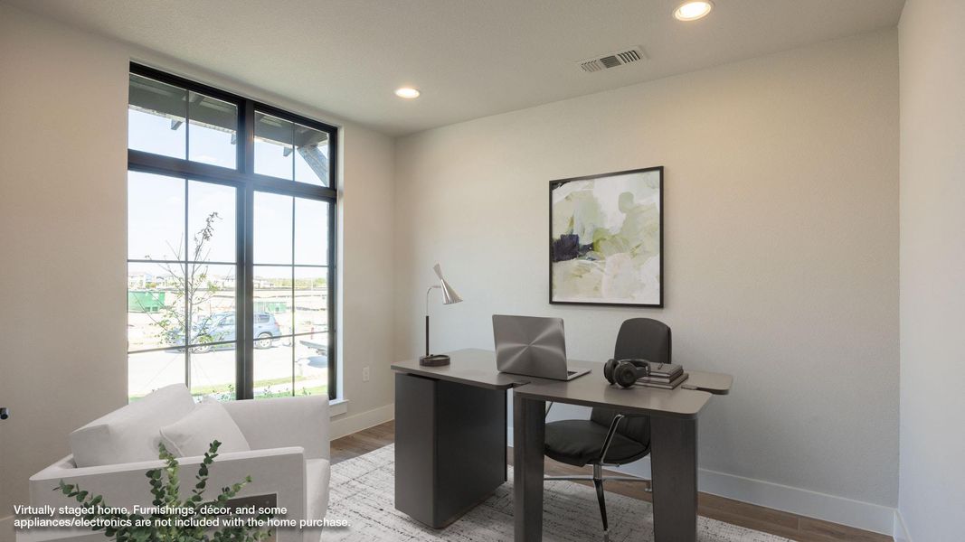 Office featuring light wood-type flooring and recessed lighting