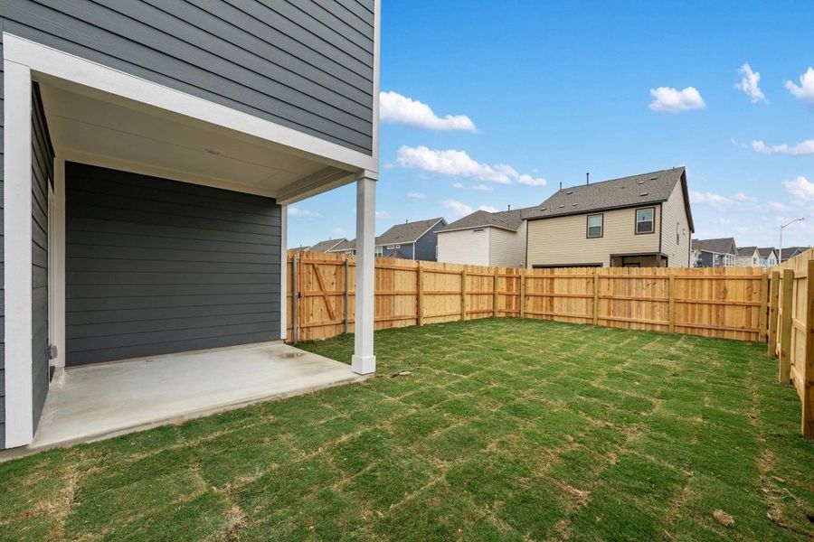Exterior details and patio area of a home in The Cottages at Lariat, Liberty Hill (Image 28).
