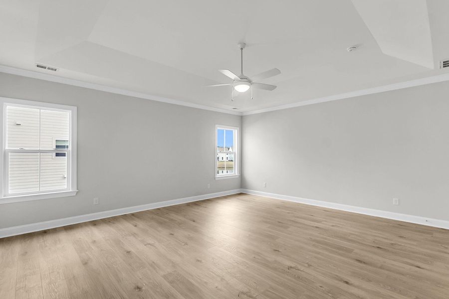 Spacious, unfurnished interior of a new home in Tidewater at Lakes of Cane Bay, Summerville (Image 56).