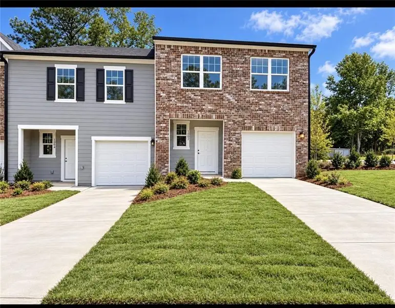 Front exterior of a new home in Chestnut Grove, Douglasville, GA, highlighting curb appeal (Image 1). Front exterior of a new home in Chestnut Grove, Douglasville, GA, highlighting curb appeal (Image 1).