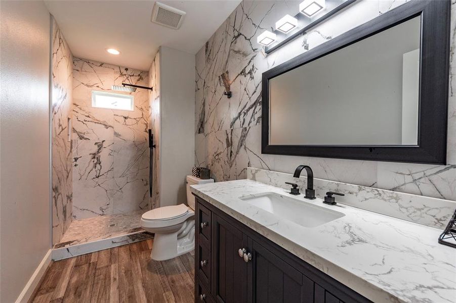 Each of the three full bathrooms boasts modern fixtures and upscale finishes, including spa-like showers and elegant tile work for ultimate comfort and style.