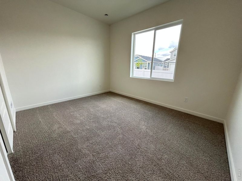 Spacious, unfurnished interior of a new home in Union Colony West, Greeley (Image 14).