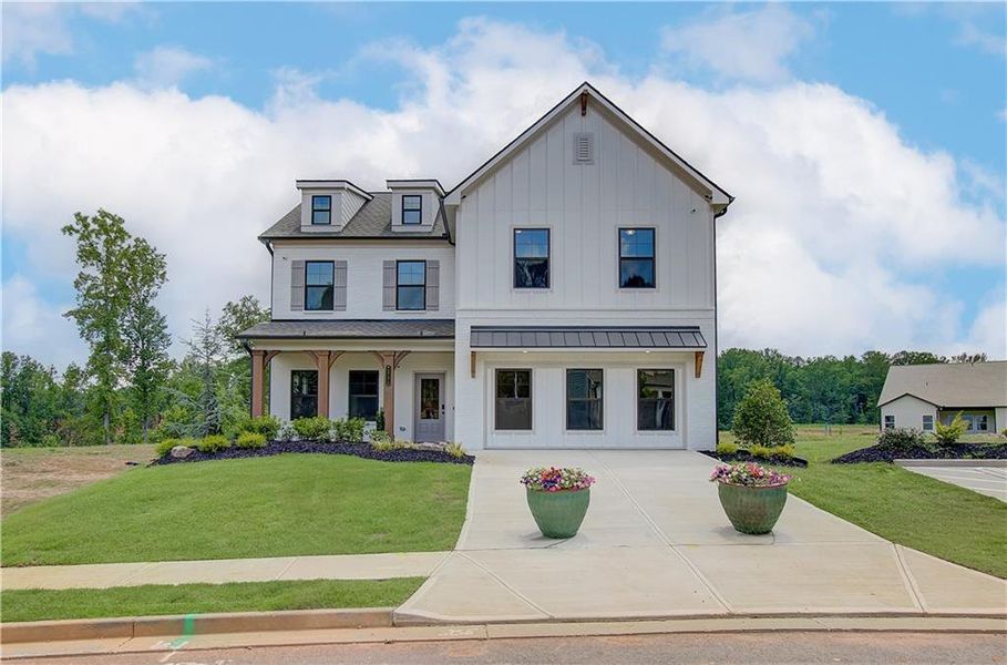 Front exterior of a new home in Rosewood Lake Estates, Hoschton, GA, highlighting curb appeal (Image 28).