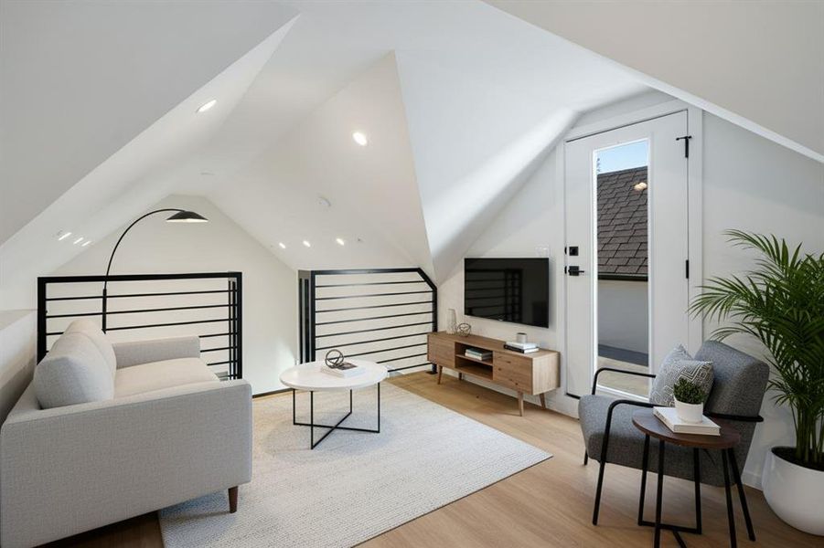 Living room featuring light wood-style floors and recessed lighting