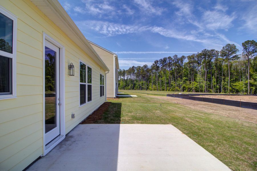 Exterior details and patio area of a home in , Ravenel (Image 25).