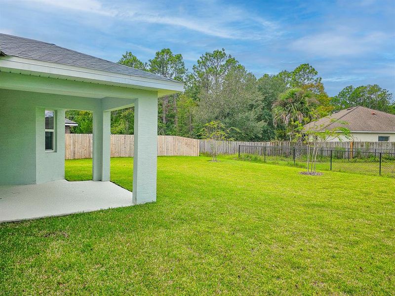 Front exterior of a new home in , Palm Coast, FL, highlighting curb appeal (Image 23).
