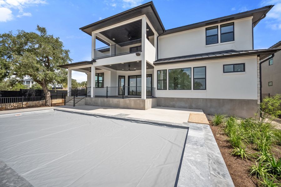 Front exterior of a new home in Milky Way at River Place, Austin, TX, highlighting curb appeal (Image 2). Front exterior of a new home in Milky Way at River Place, Austin, TX, highlighting curb appeal (Image 2).
