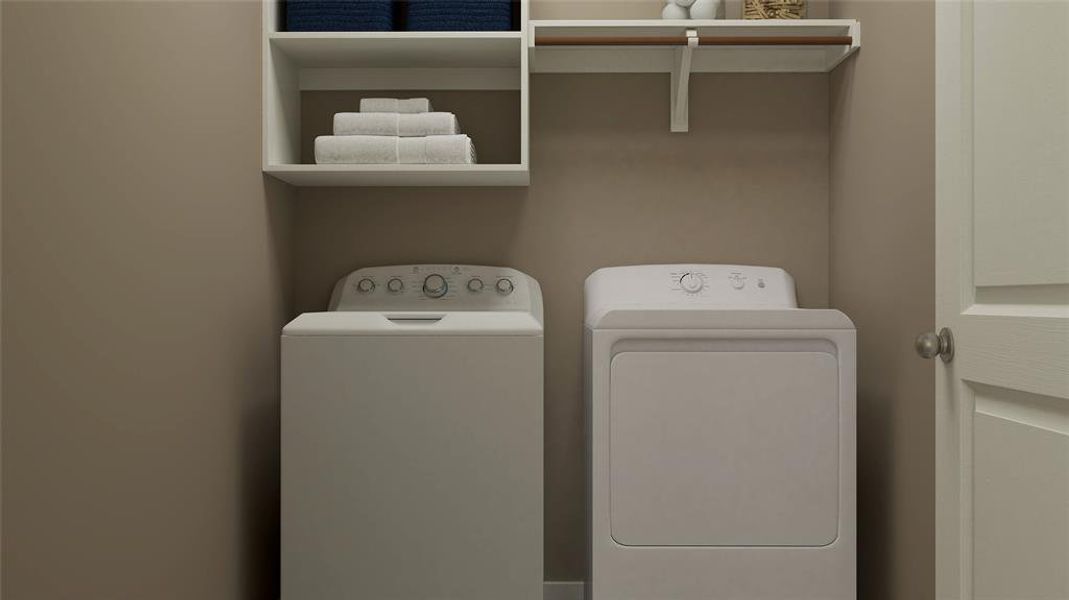 Washroom featuring washer and dryer