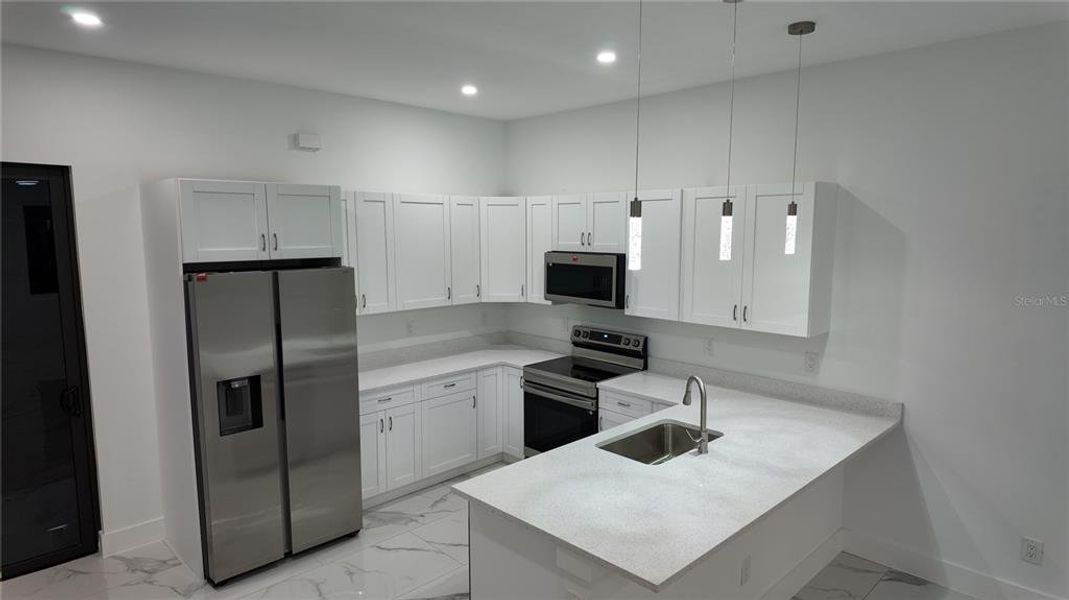 Furnished interior view inside a new home in , Port Charlotte (Image 5).