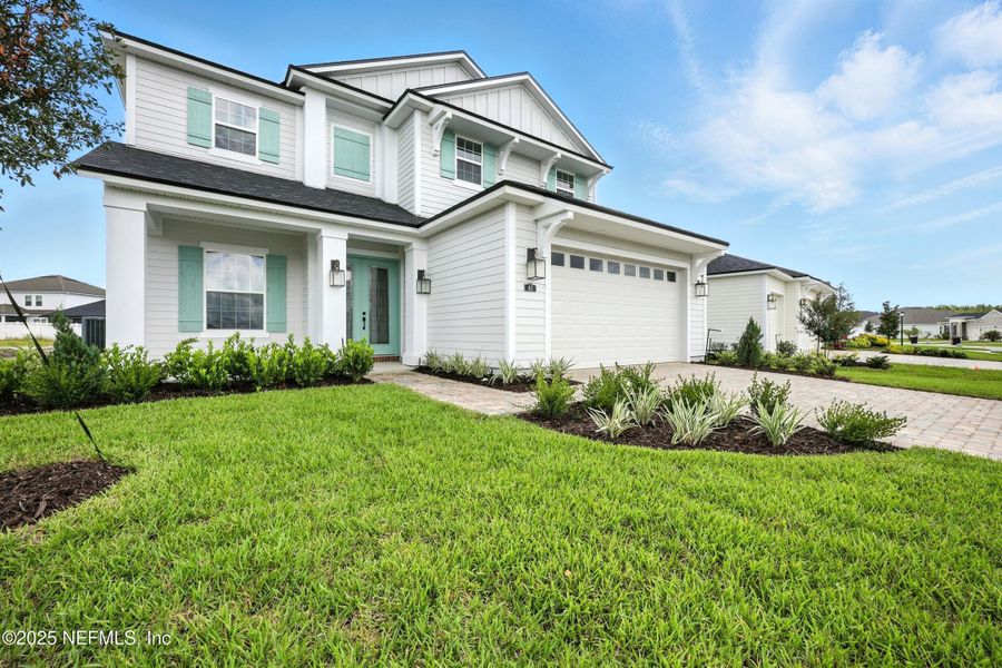 Front exterior of a new home in Silver Landing At Silverleaf, St. Augustine, FL, highlighting curb appeal (Image 24).