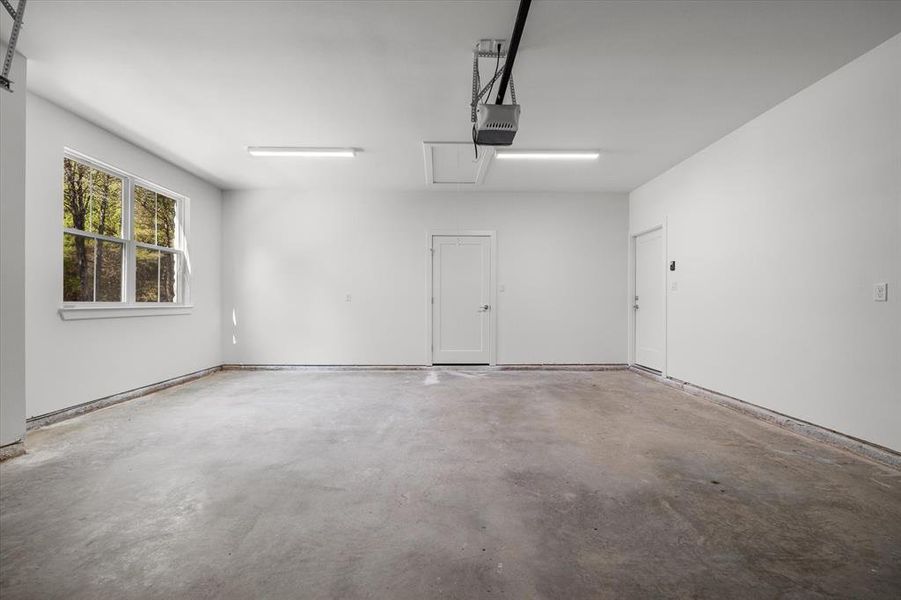 Garage featuring a garage door opener