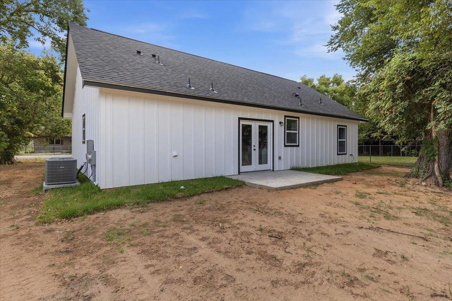 Board and batten siding meets a classic shingle roofline on this modern exterior. Board and batten siding meets a classic shingle roofline on this modern exterior.