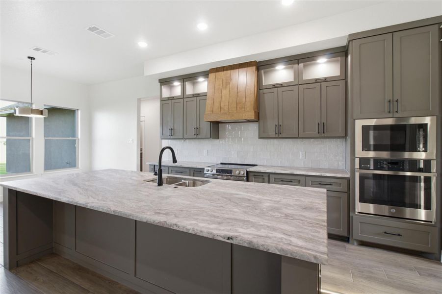 Culinary dreams come alive in this kitchen featuring abundant counter space and modern appliances. Culinary dreams come alive in this kitchen featuring abundant counter space and modern appliances.