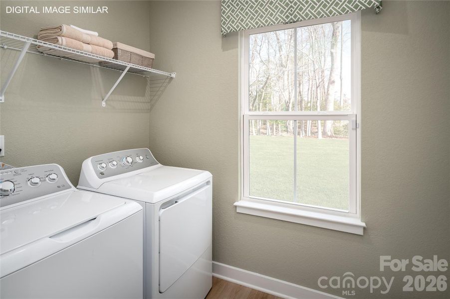 First-floor laundry room with optional utility sink—conveniently located for everyday use. First-floor laundry room with optional utility sink—conveniently located for everyday use.