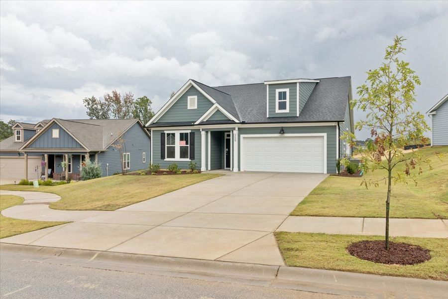 Front exterior of a new home in Sinclair at Crawford Creek, Grovetown, GA, highlighting curb appeal (Image 21). Front exterior of a new home in Sinclair at Crawford Creek, Grovetown, GA, highlighting curb appeal (Image 21).