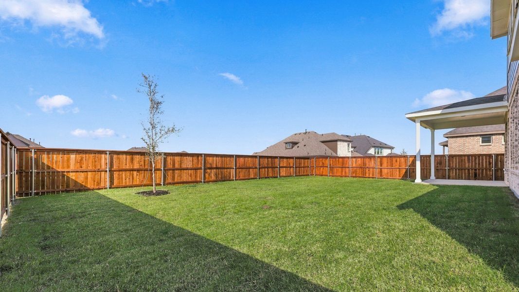 Exterior details and patio area of a home in Green Meadows Classic, Celina (Image 3).