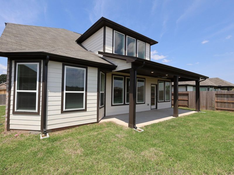 Front exterior of a new home in Summerview, Fulshear, TX, highlighting curb appeal (Image 1).