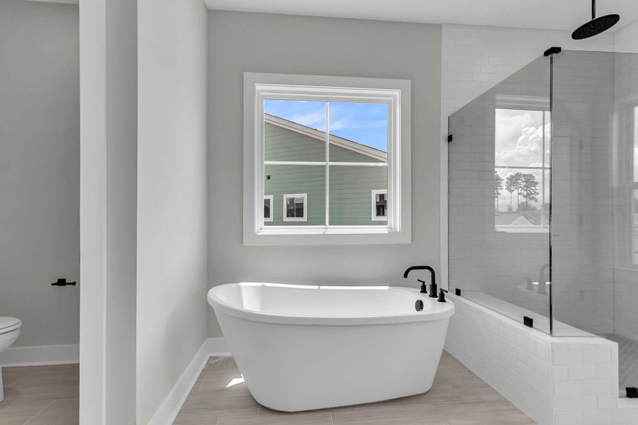 Furnished interior view inside a new home in Tidewater at Lakes of Cane Bay, Summerville (Image 11).