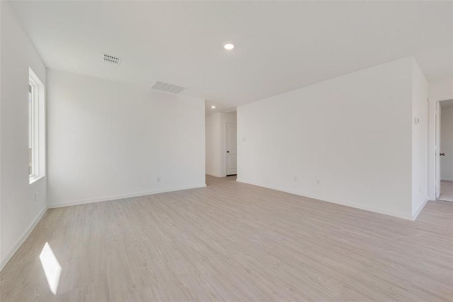 Unfurnished room with light wood-type flooring