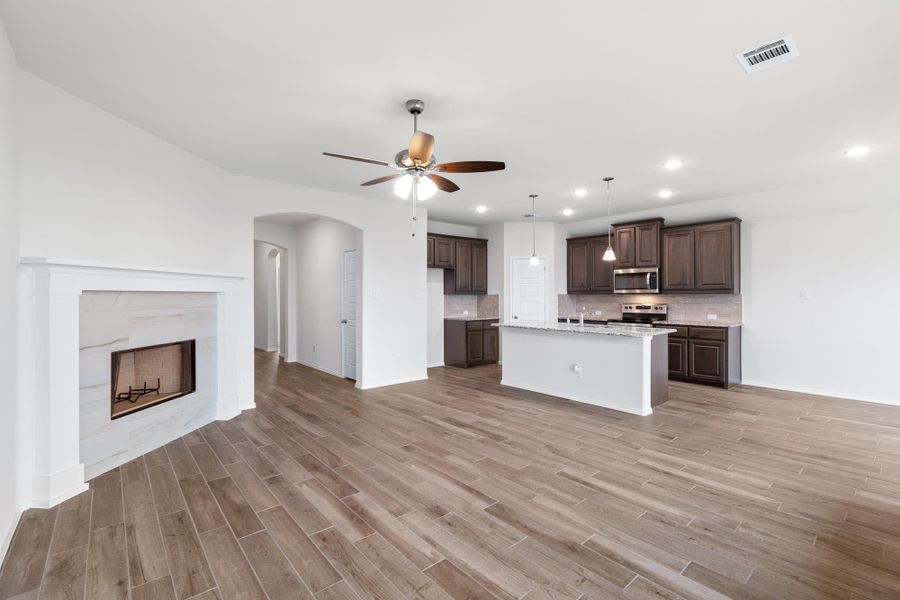 Family Room & Kitchen | Concept 1660 at Hunters Ridge in Crowley, TX by Landsea Homes