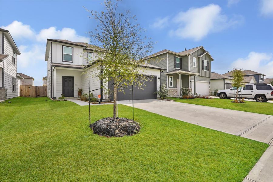 Front exterior of a new home in Barrett Crossing, Crosby, TX, highlighting curb appeal (Image 2). Front exterior of a new home in Barrett Crossing, Crosby, TX, highlighting curb appeal (Image 2).