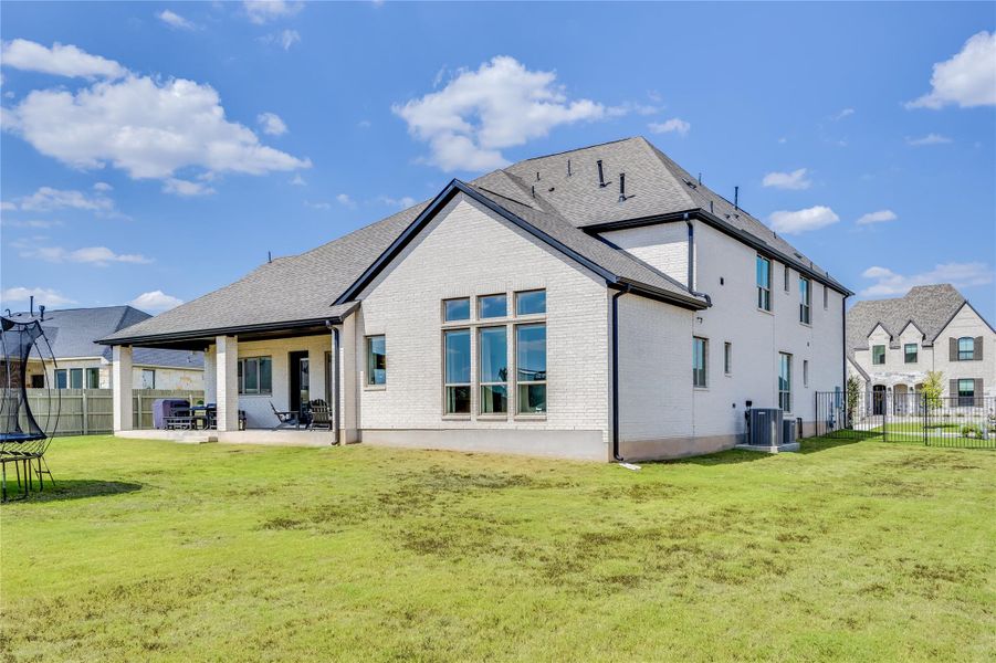 Exterior details and patio area of a home in Santa Rita Ranch 90', Liberty Hill (Image 4). Exterior details and patio area of a home in Santa Rita Ranch 90', Liberty Hill (Image 4).