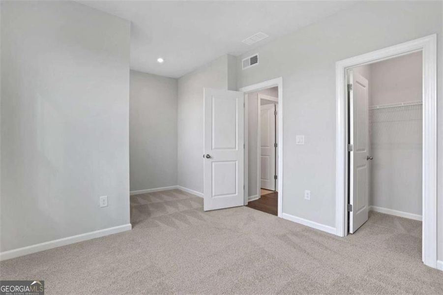 Spacious, unfurnished interior of a new home in The Paddocks at Doc Hughes, Buford (Image 56).