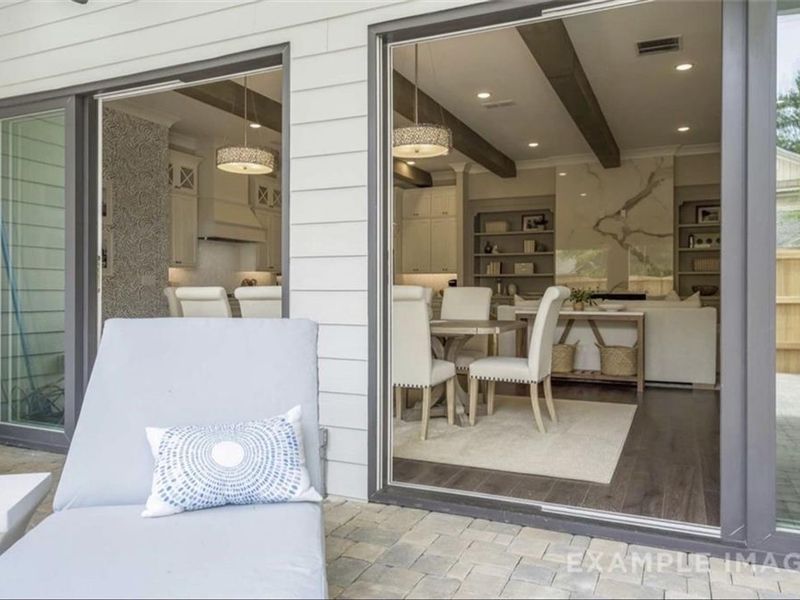 Exterior details and patio area of a home in The Village at Towne Lake, Woodstock (Image 27).
