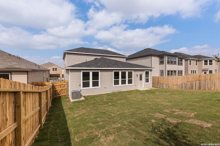 Exterior details and patio area of a home in Hidden Bluffs at TRP, San Antonio (Image 20).