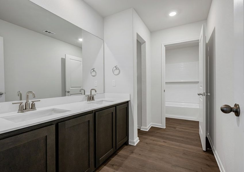 The secondary bathroom has a sprawling vanity. The secondary bathroom has a sprawling vanity.