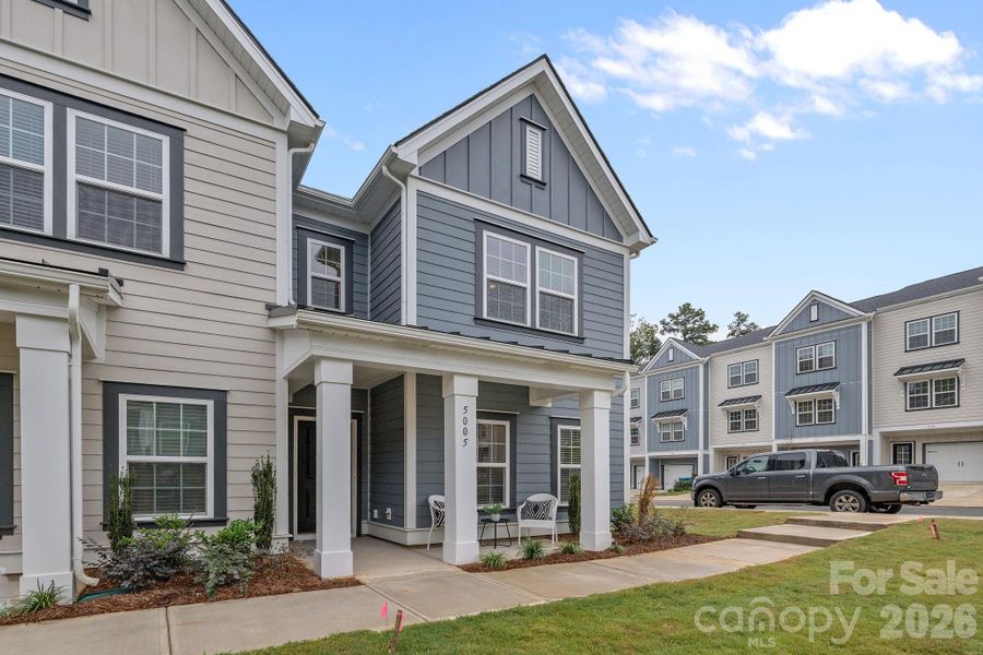 Front exterior of a new home in Sycamore Trail, Matthews, NC, highlighting curb appeal (Image 22).