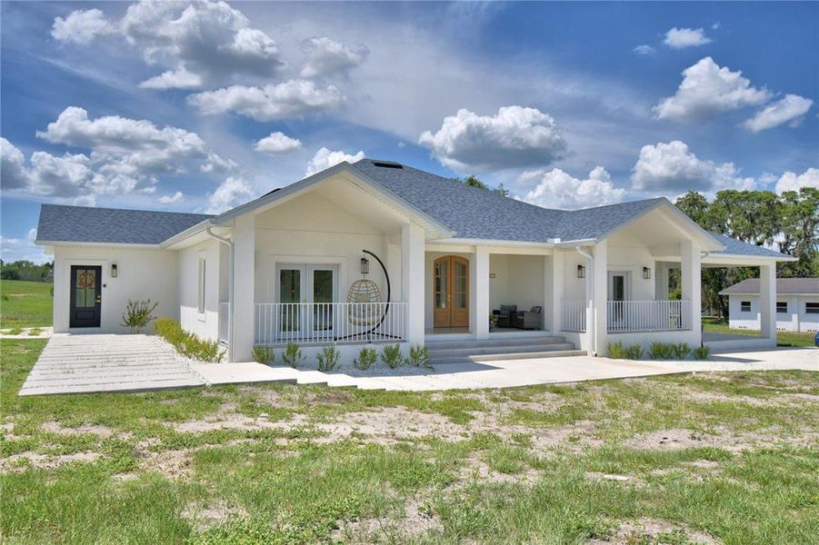 Front exterior of a new home in , Polk City, FL, highlighting curb appeal (Image 2).