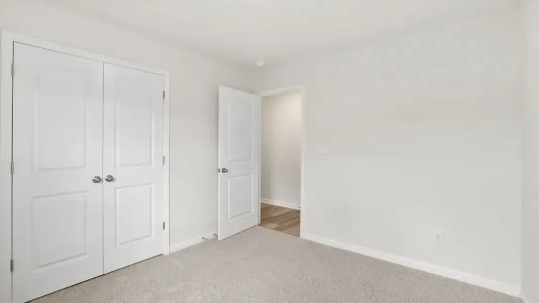 Spacious, unfurnished interior of a new home in Village Grove, Greenville (Image 22).
