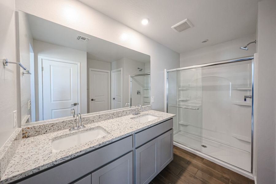 A bathroom with a glass shower.